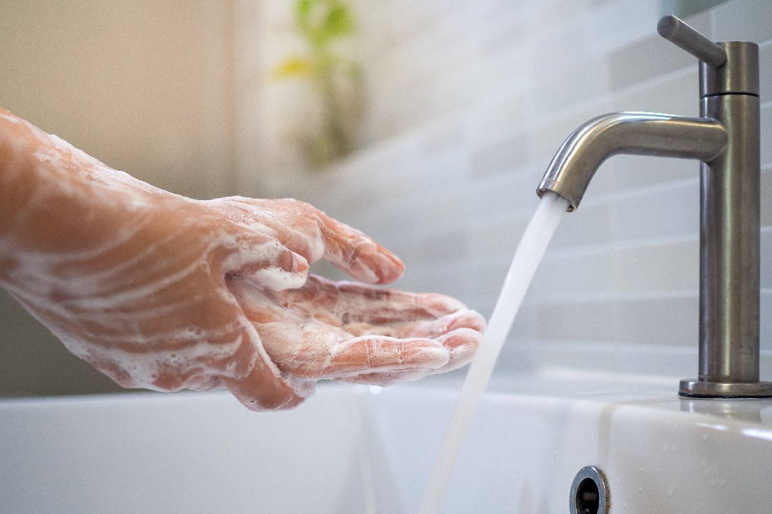 Wash hands with soap and wash with running water. Close up of women scrub hand soap with wash basin .The concept of hand hygiene and hand washing days around the world. Reducing infection Covit-19 stock photo